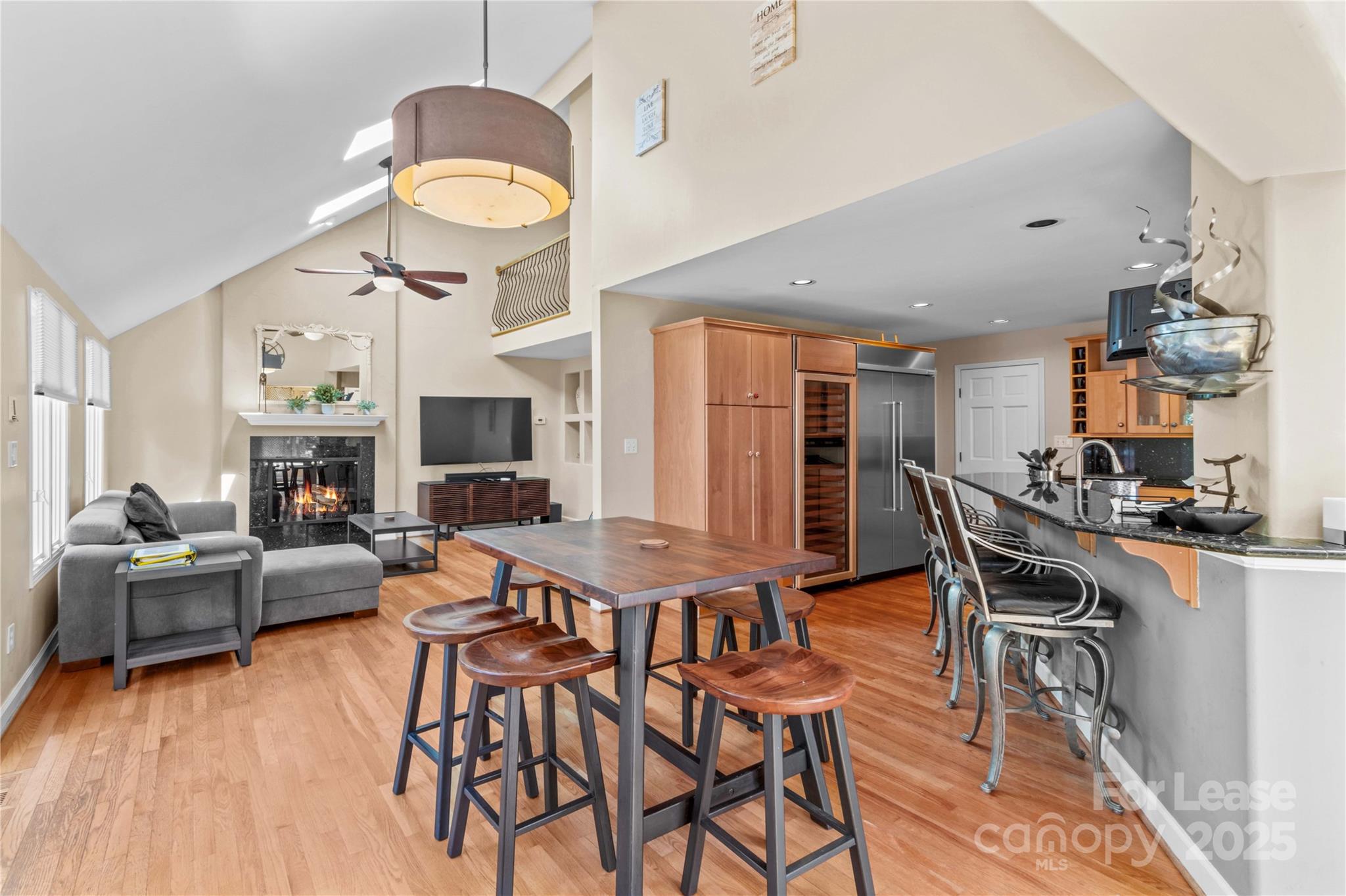 709 Normandy Road Mooresville, NC 28117 - Photo 12 of 46 a view of a dining room with furniture a kitchen and chandelier
