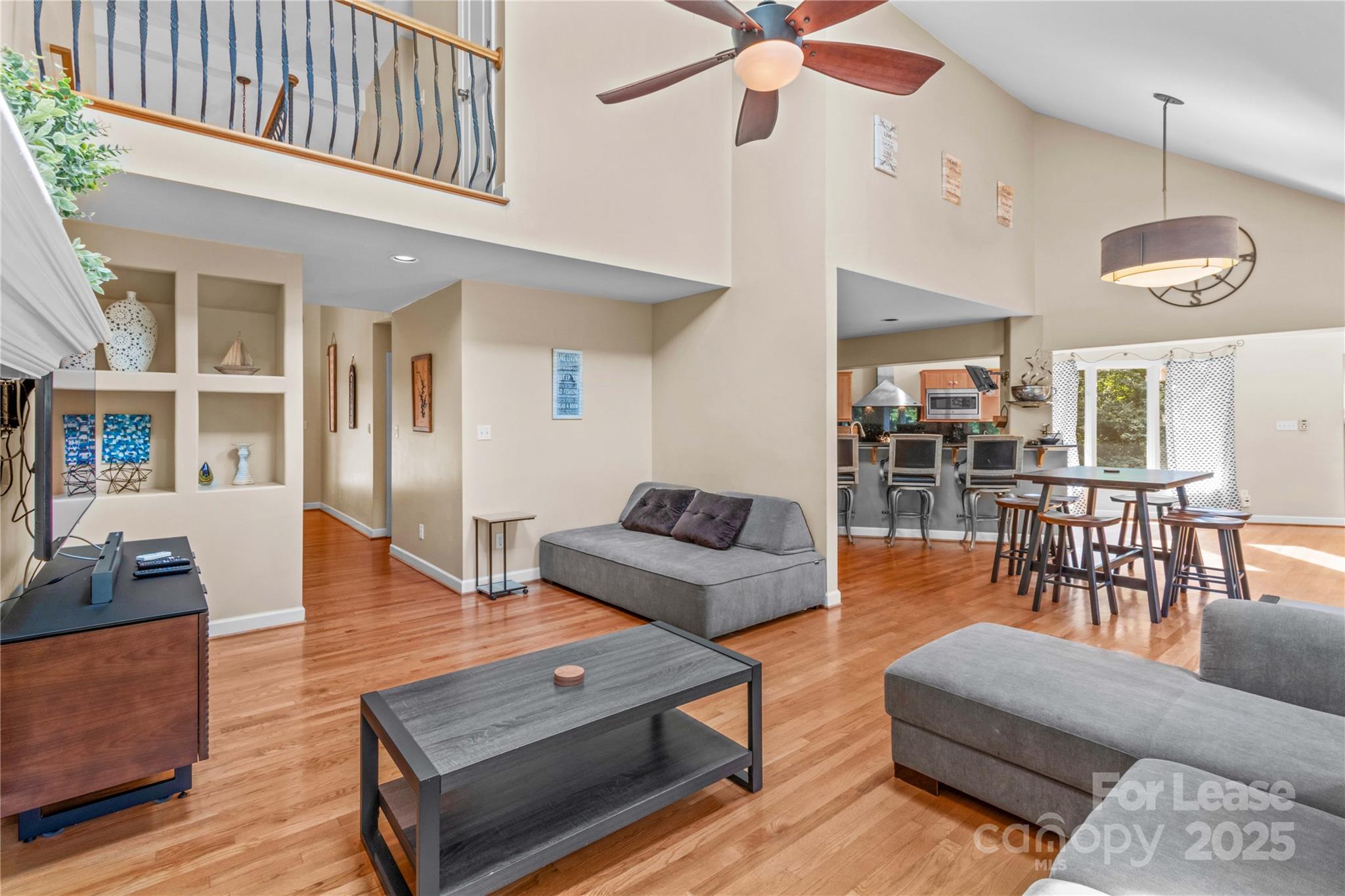 709 Normandy Road Mooresville, NC 28117 - Photo 13 of 46 a living room with furniture and wooden floor