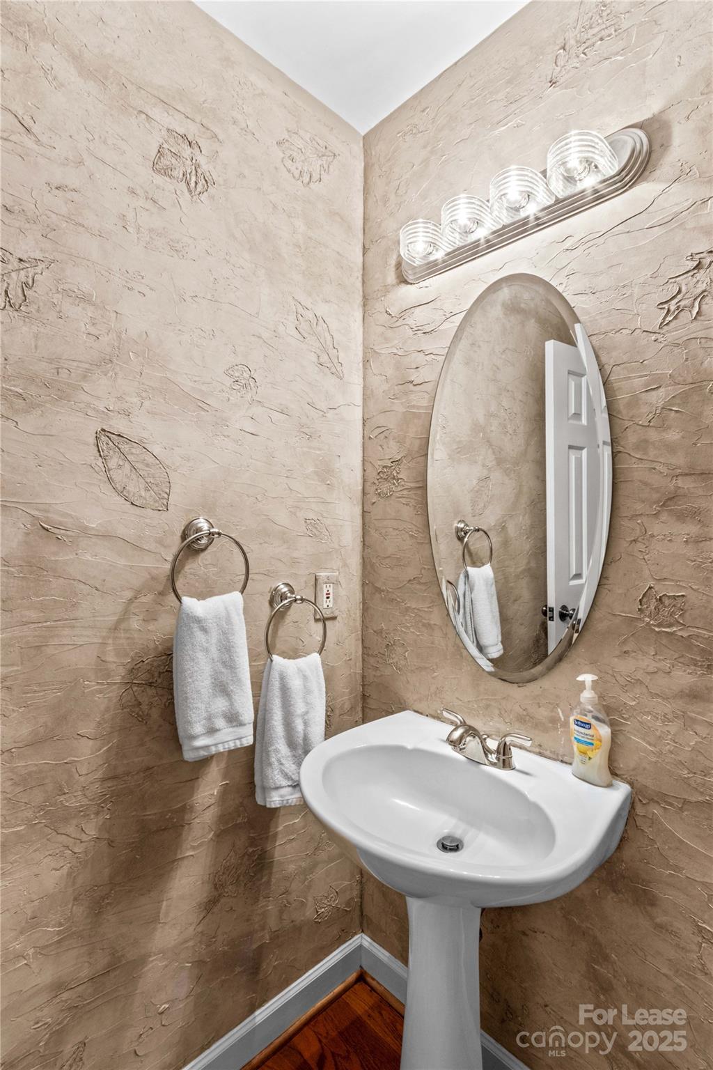 709 Normandy Road Mooresville, NC 28117 - Photo 16 of 46 a bathroom with a sink and a mirror