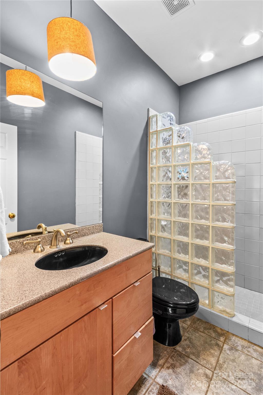 709 Normandy Road Mooresville, NC 28117 - Photo 30 of 46 a bathroom with a sink and a mirror