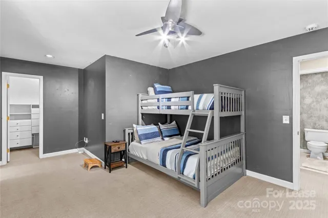 a bed room with a bed and a television