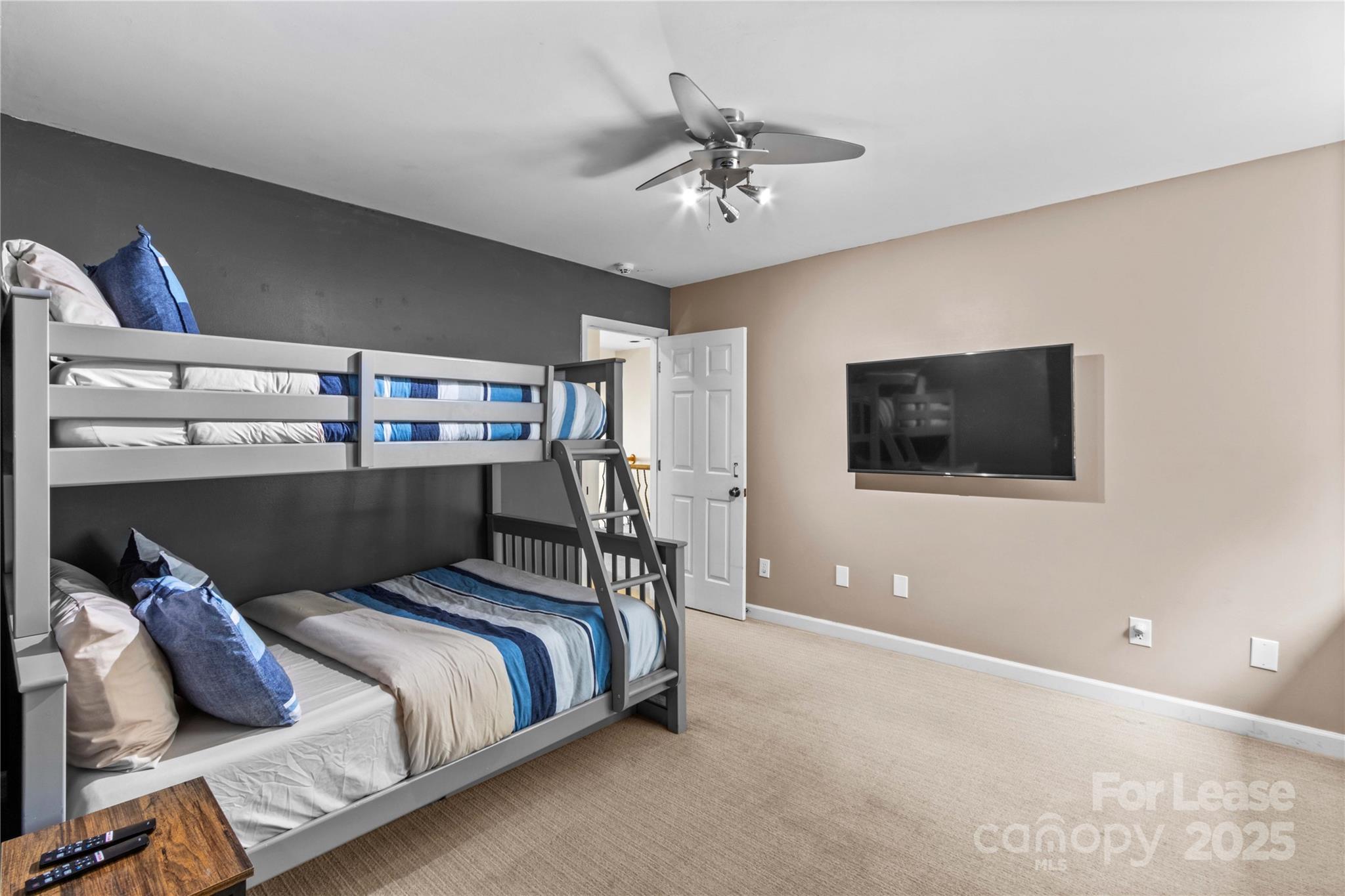 709 Normandy Road Mooresville, NC 28117 - Photo 33 of 46 a bed room with a bed and a television