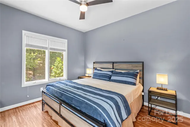 a bed room with a bed and a chandelier