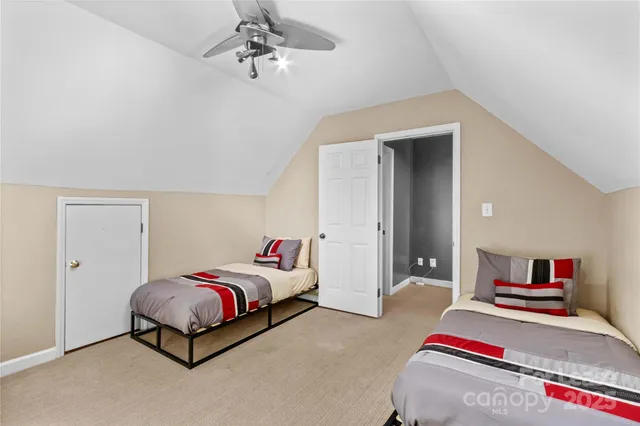 a view of a livingroom with furniture and a large window