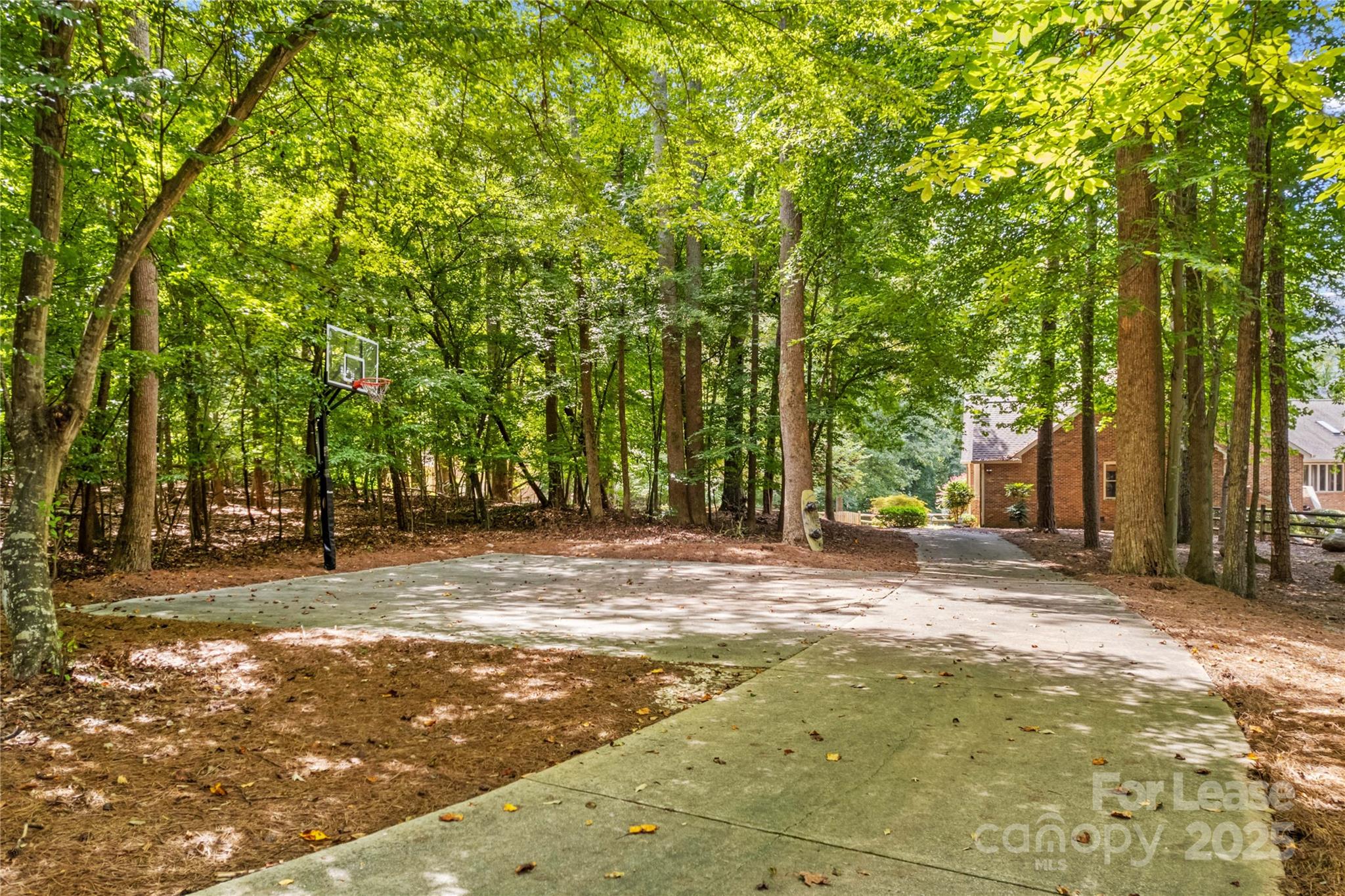 709 Normandy Road Mooresville, NC 28117 - Photo 41 of 46 a view of a yard with large trees