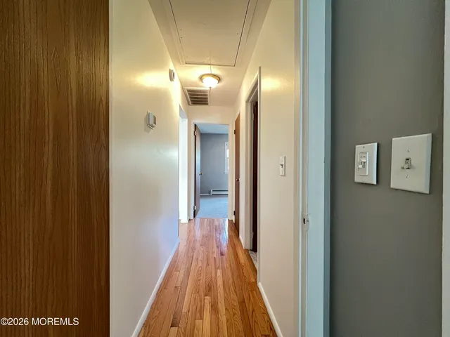a view of a bathroom from a hallway