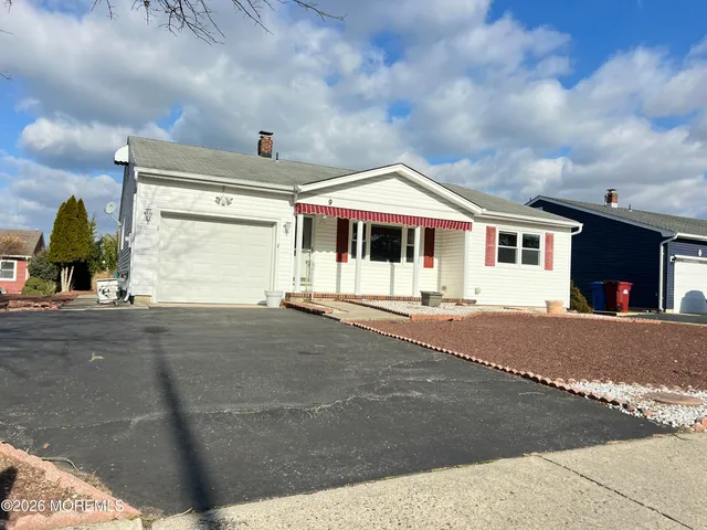 a front view of a house with a garage