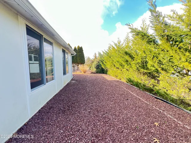 a view of a yard with an plants and trees