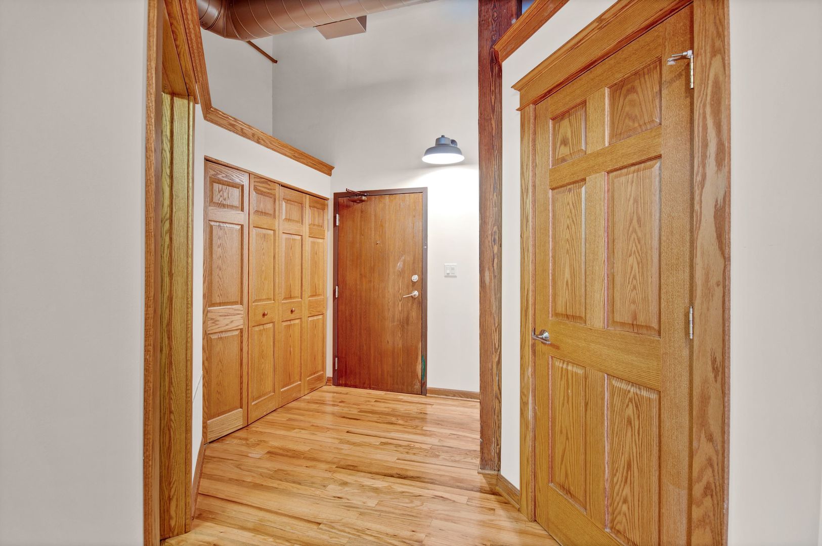 216 North May Street, Unit 403 Chicago, IL 60607 - Photo 12 of 18 a view of a bathroom with wooden floor
