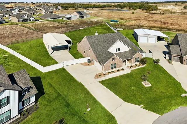 an aerial view of a house with a outdoor space