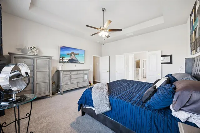 a bed room with a bed and dresser