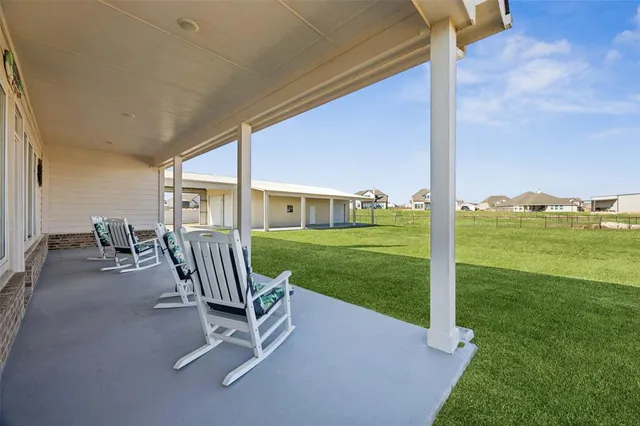 a view of a patio with a backyard