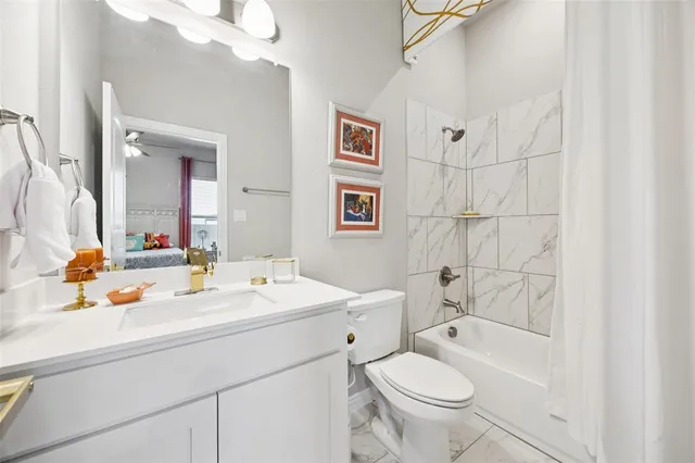 a en suite bathroom with a toilet sink and mirror