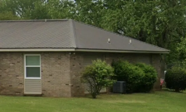 a view of a backyard of the house