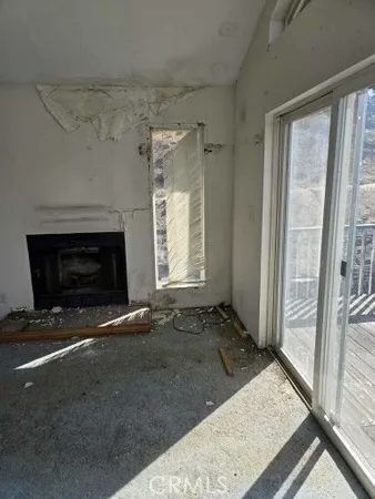 a view of an empty room and window