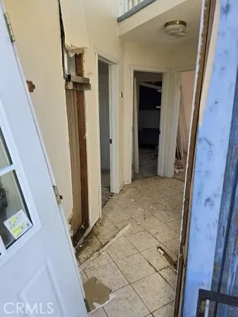 a kitchen with a refrigerator and a stove