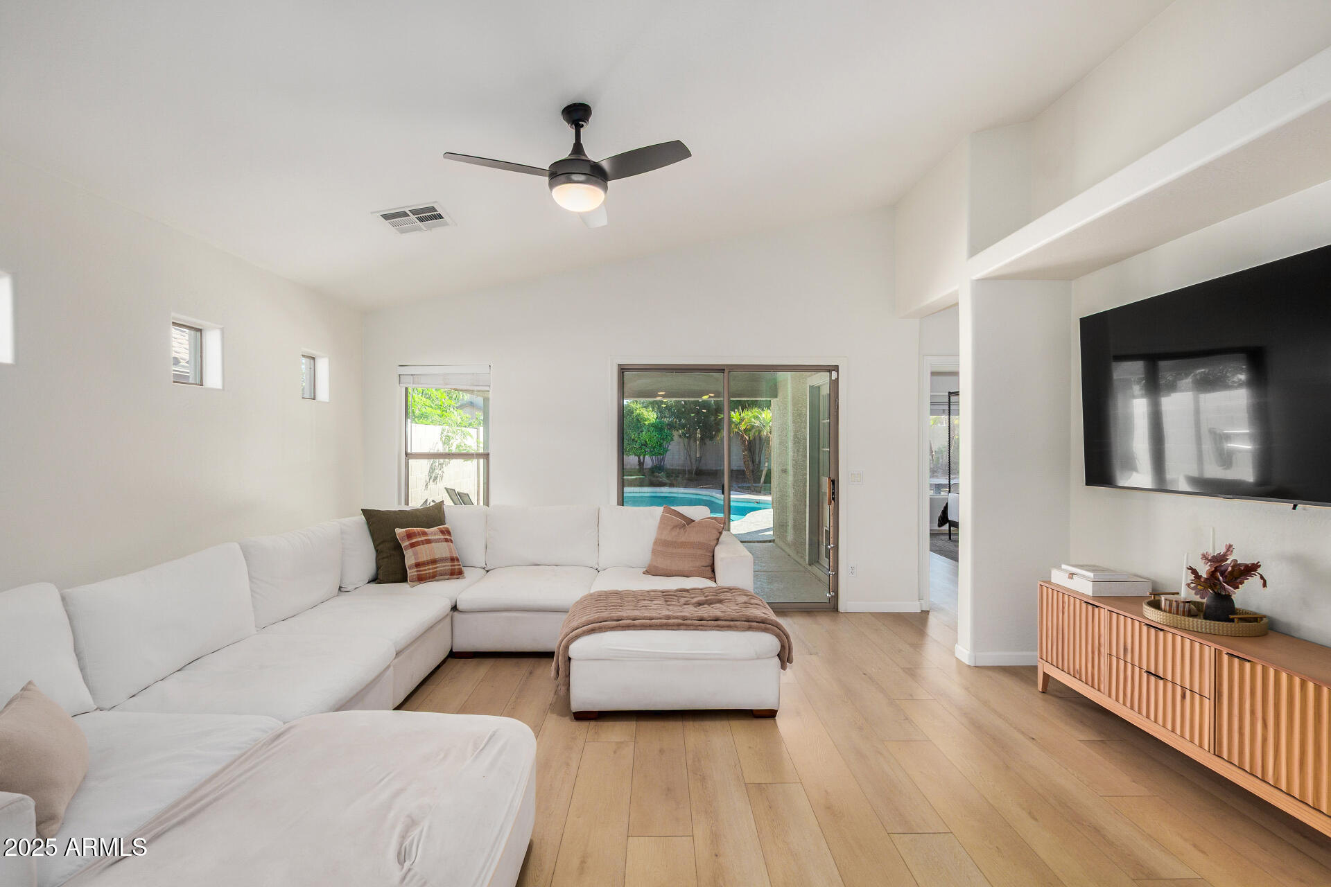 3433 East Hopkins Road Gilbert, AZ 85295 - Photo 15 of 38 a living room with furniture and a wooden floor