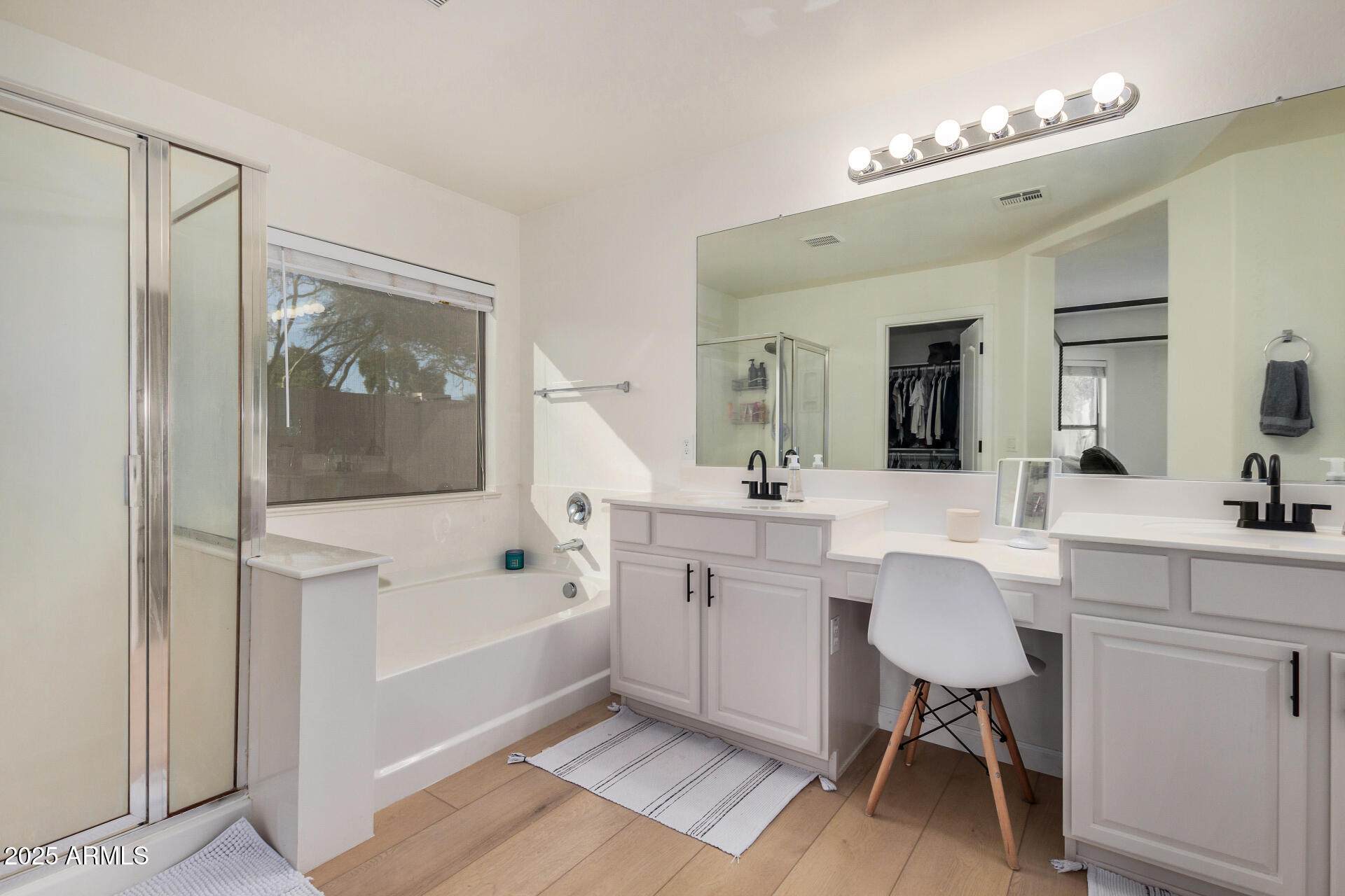 3433 East Hopkins Road Gilbert, AZ 85295 - Photo 24 of 38 a bathroom with a sink a toilet a mirror and a tub