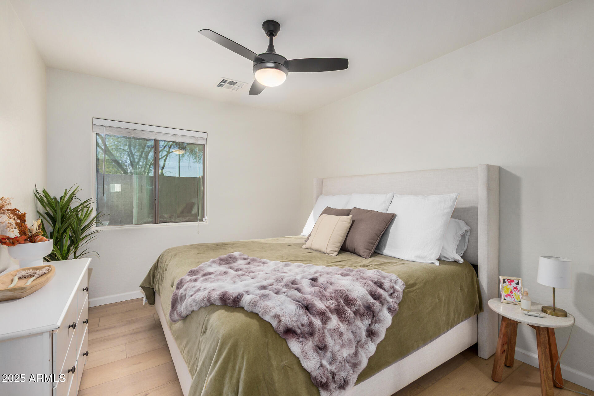 3433 East Hopkins Road Gilbert, AZ 85295 - Photo 27 of 38 a bedroom with a large bed and a potted plant