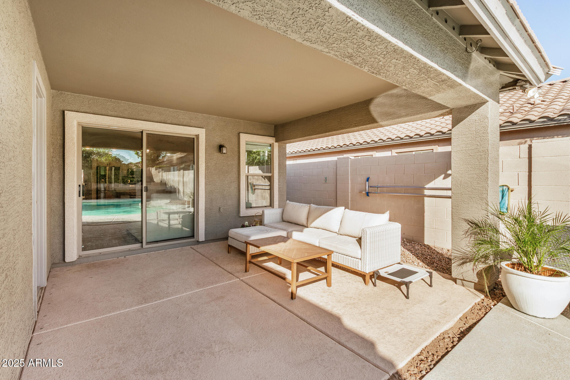 3433 East Hopkins Road Gilbert, AZ 85295 - Photo 33 of 38 a living room with furniture and a potted plant