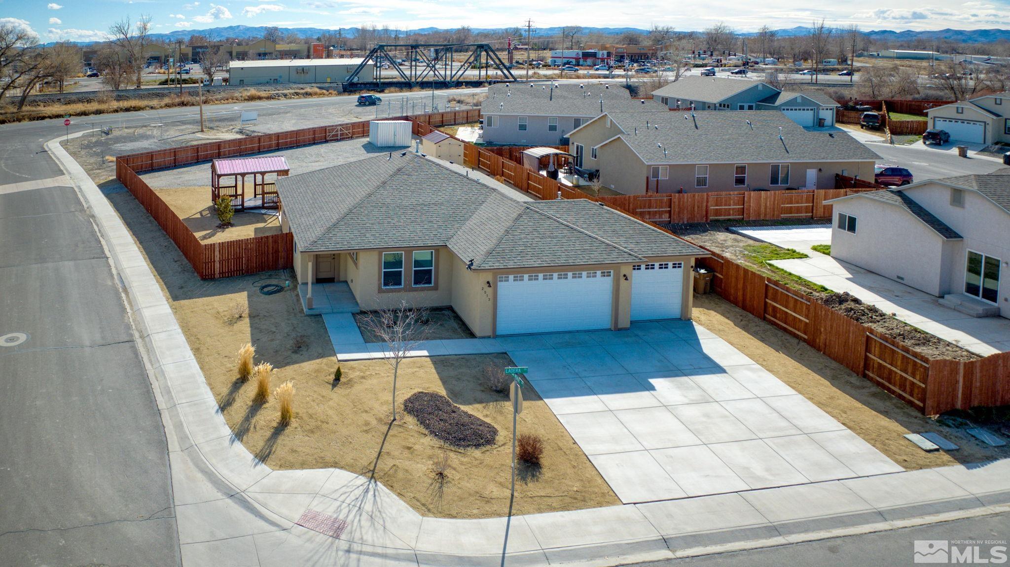 an aerial view of a house with swimming pool