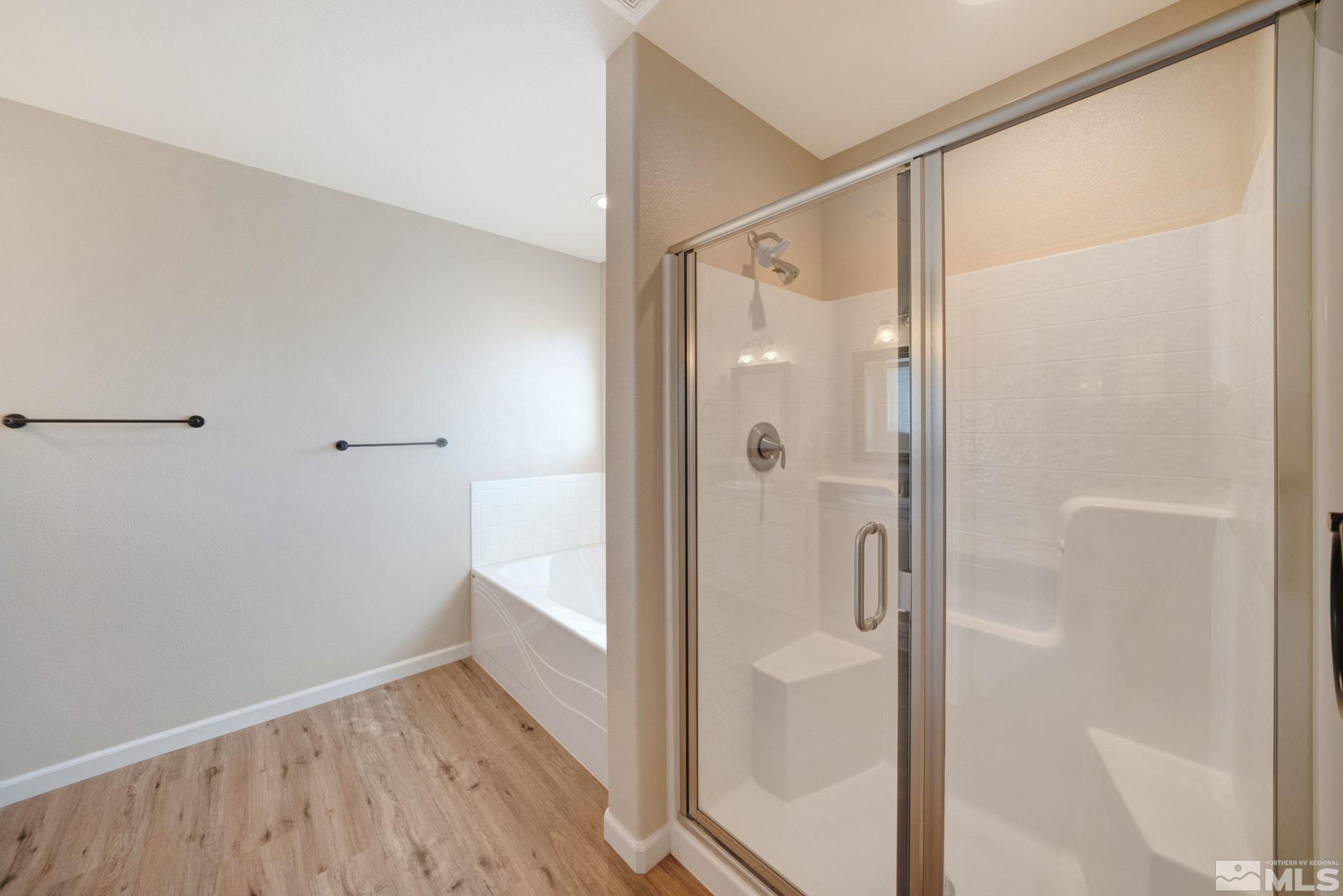 2513 Ladera Fallon, NV 89406 - Photo 17 of 30 a bathroom with a glass shower door