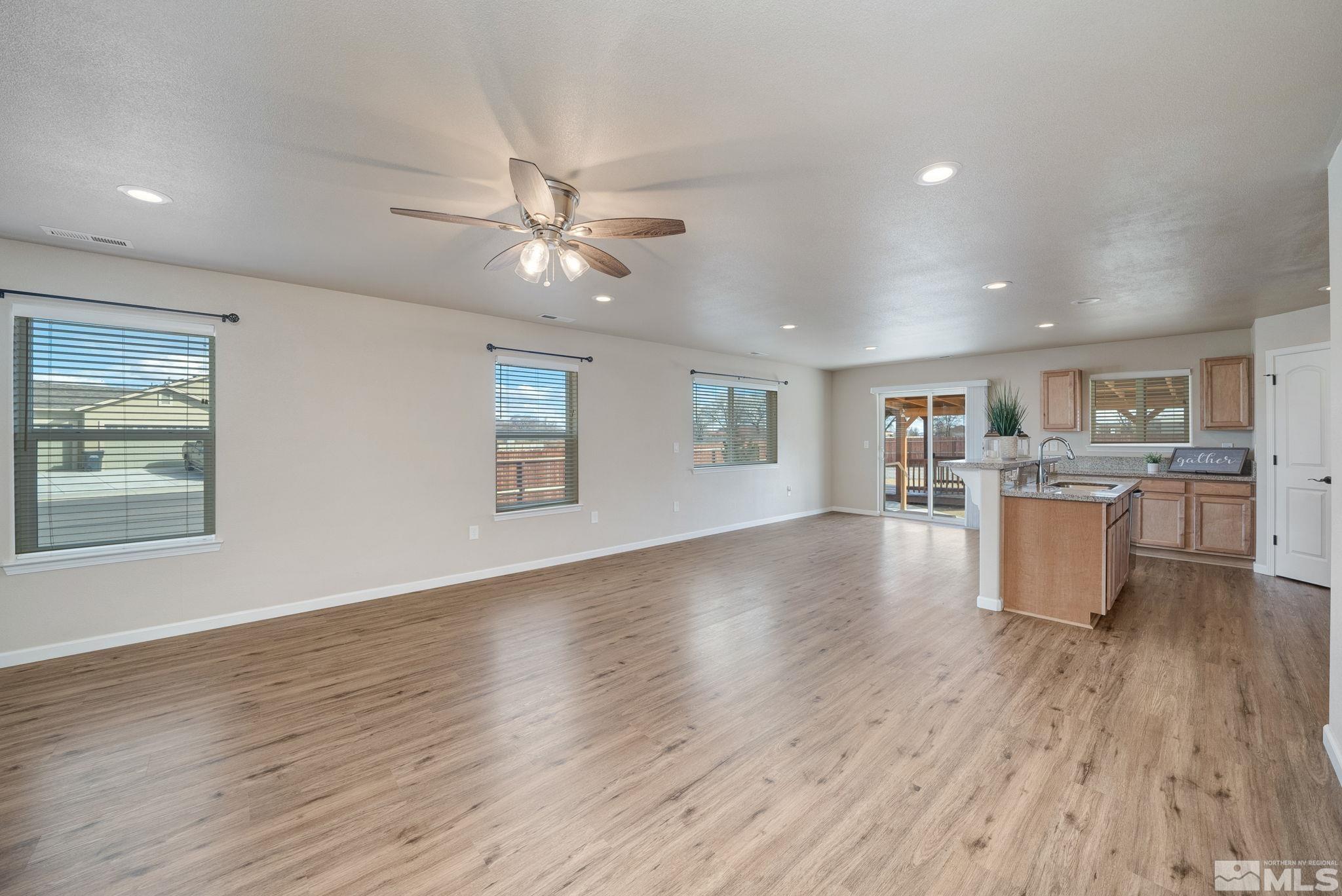 2513 Ladera Fallon, NV 89406 - Photo 7 of 30 a view of kitchen and hall with wooden floor