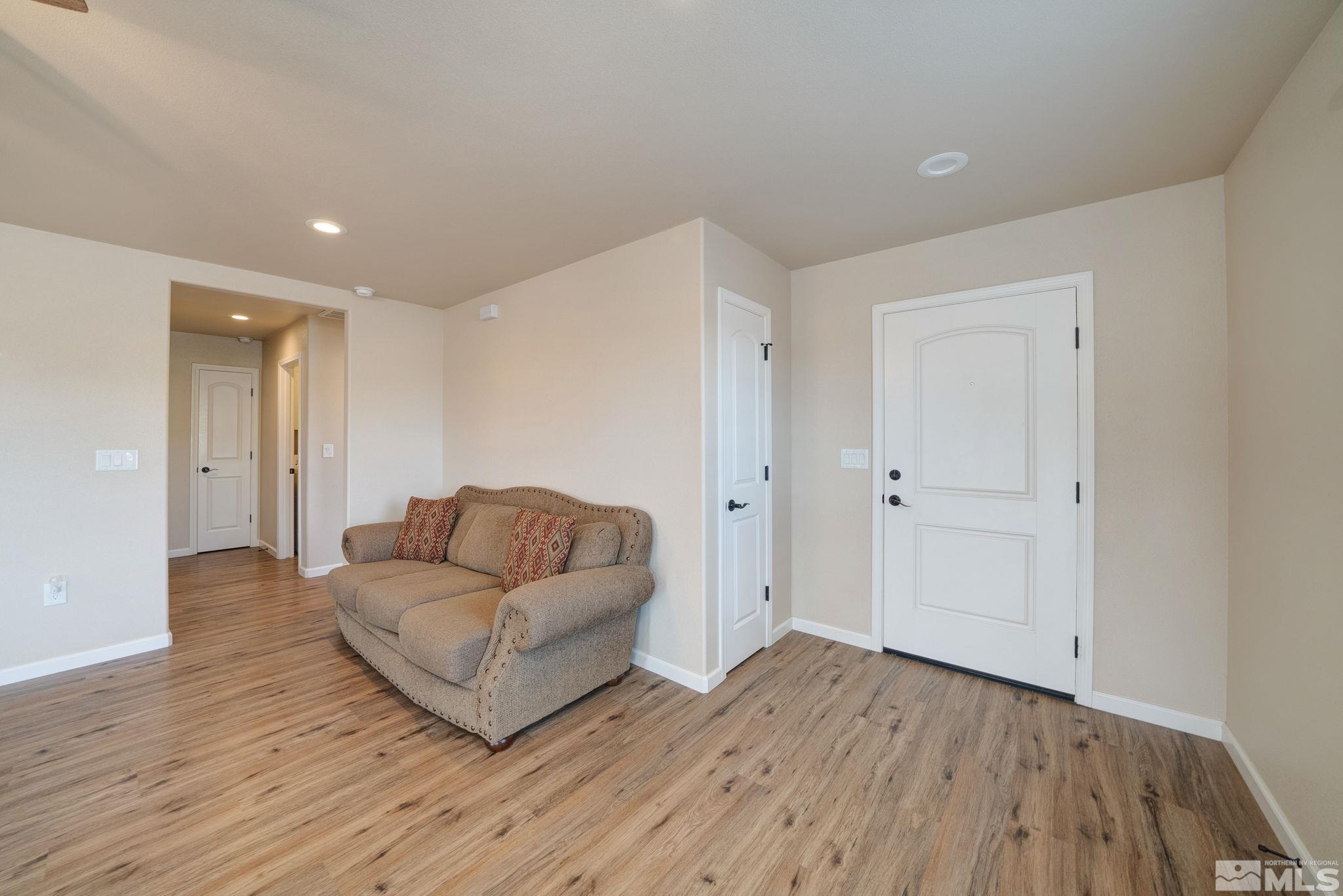 2513 Ladera Fallon, NV 89406 - Photo 9 of 30 a living room with furniture and a wooden floor
