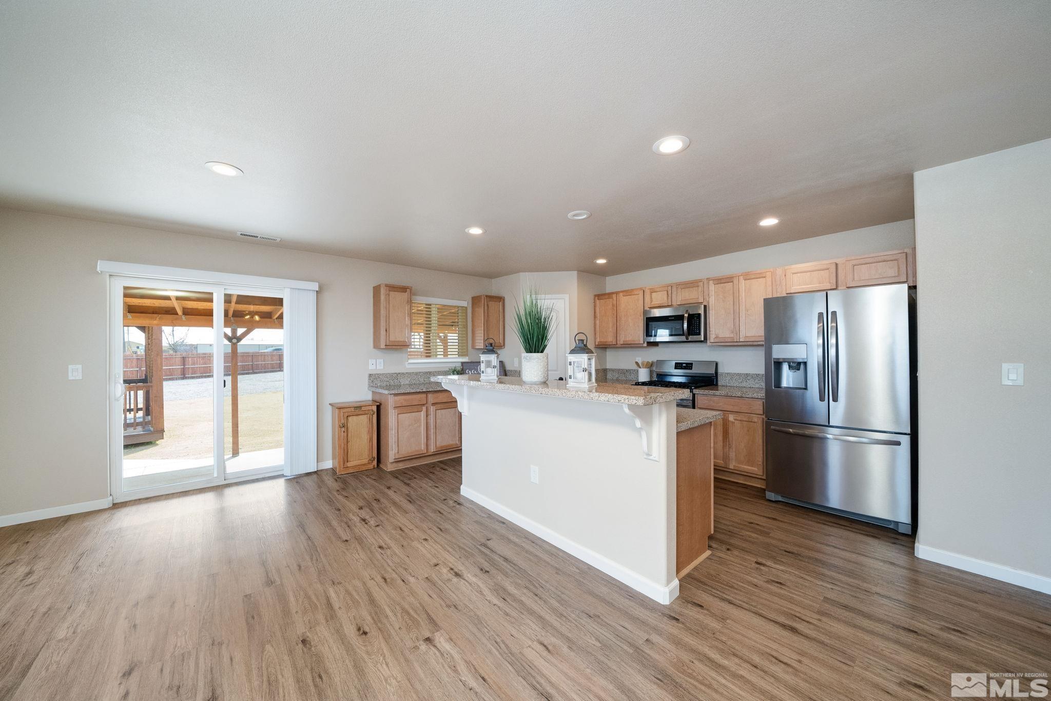 2513 Ladera Fallon, NV 89406 - Photo 10 of 30 a kitchen with white cabinets and stainless steel appliances