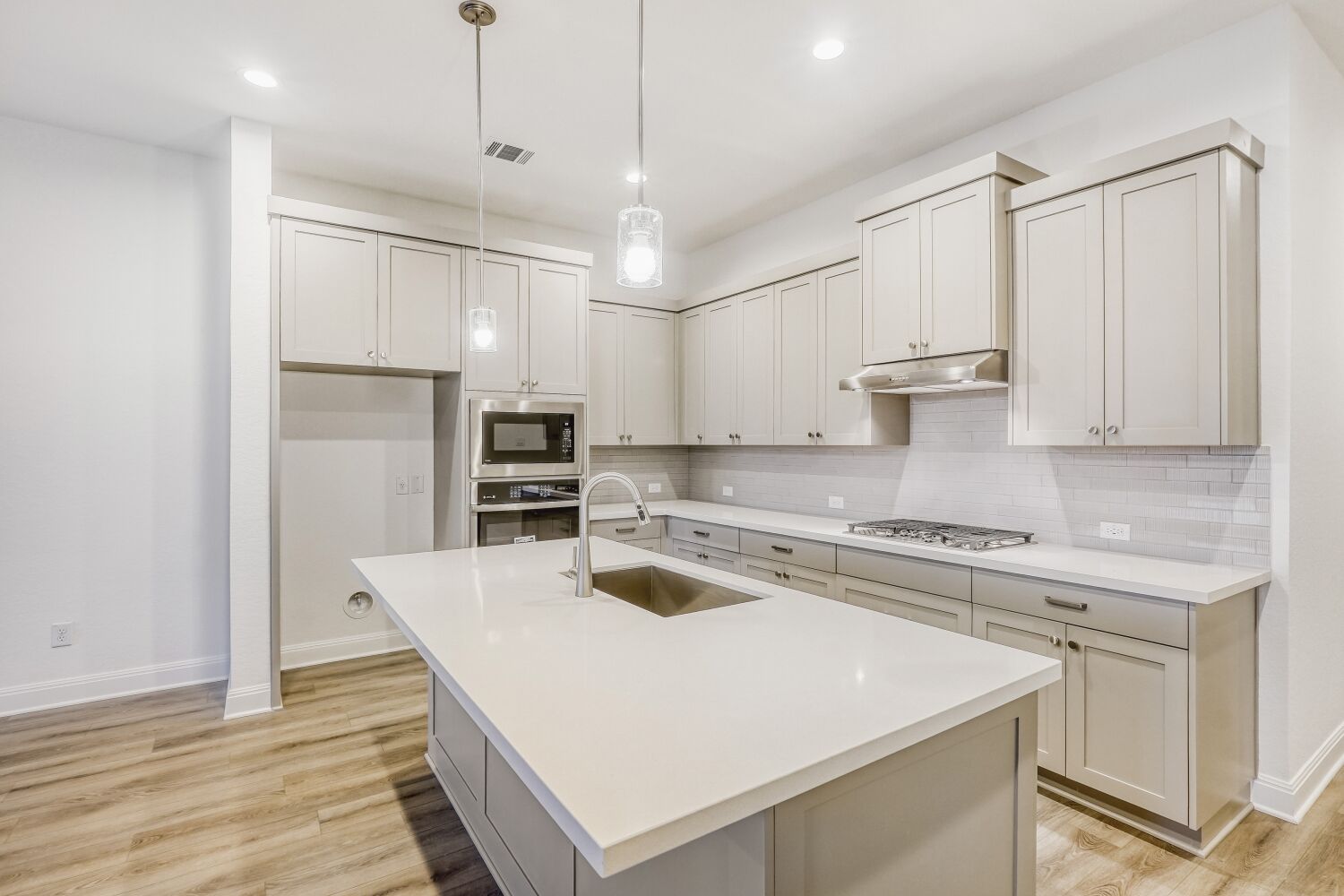 222 Prickly Poppy Loop Kyle, TX 78640 - Photo 3 of 11 a kitchen with stainless steel appliances granite countertop a sink a stove and a refrigerator
