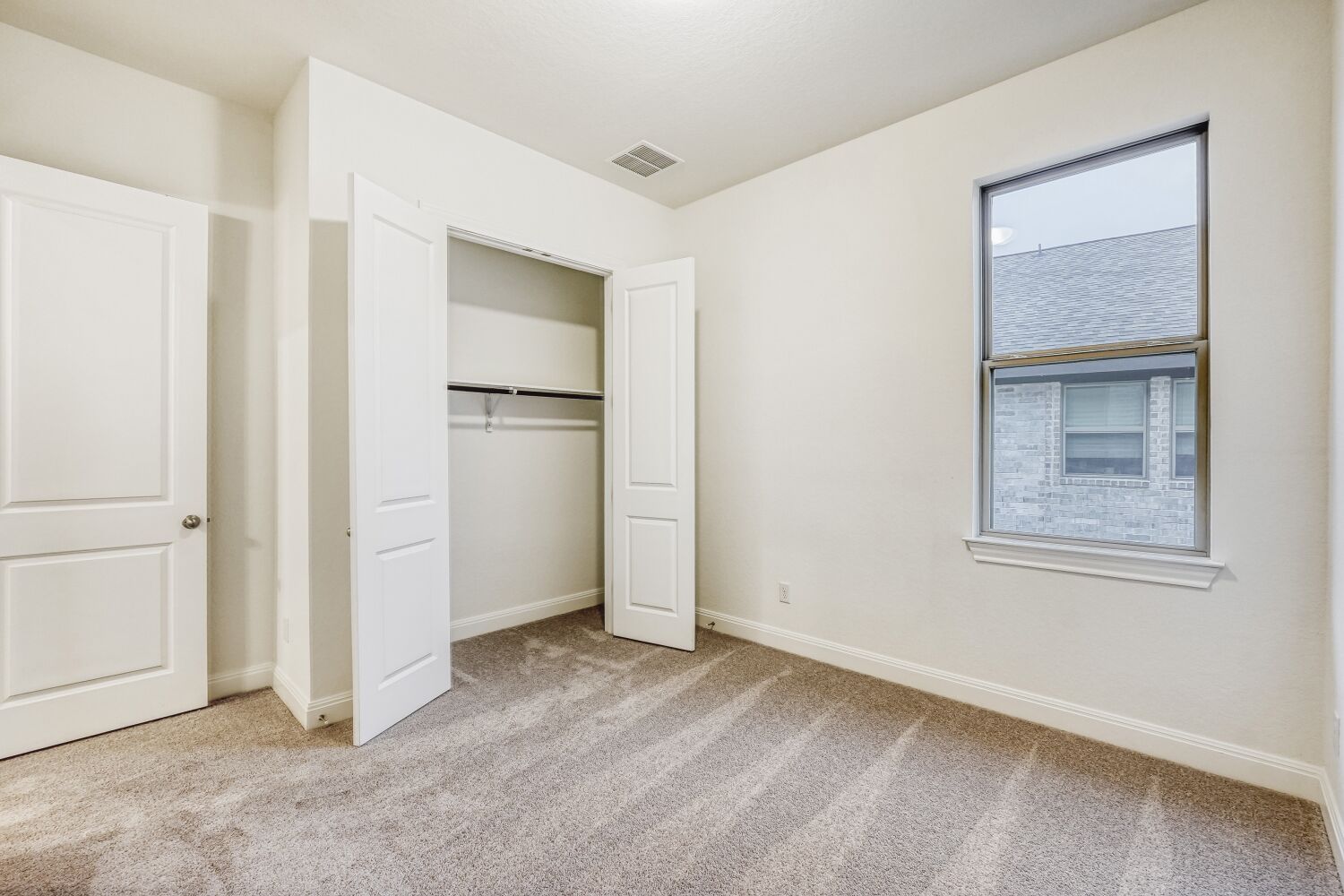 222 Prickly Poppy Loop Kyle, TX 78640 - Photo 10 of 11 a view of an empty room with closet and a window