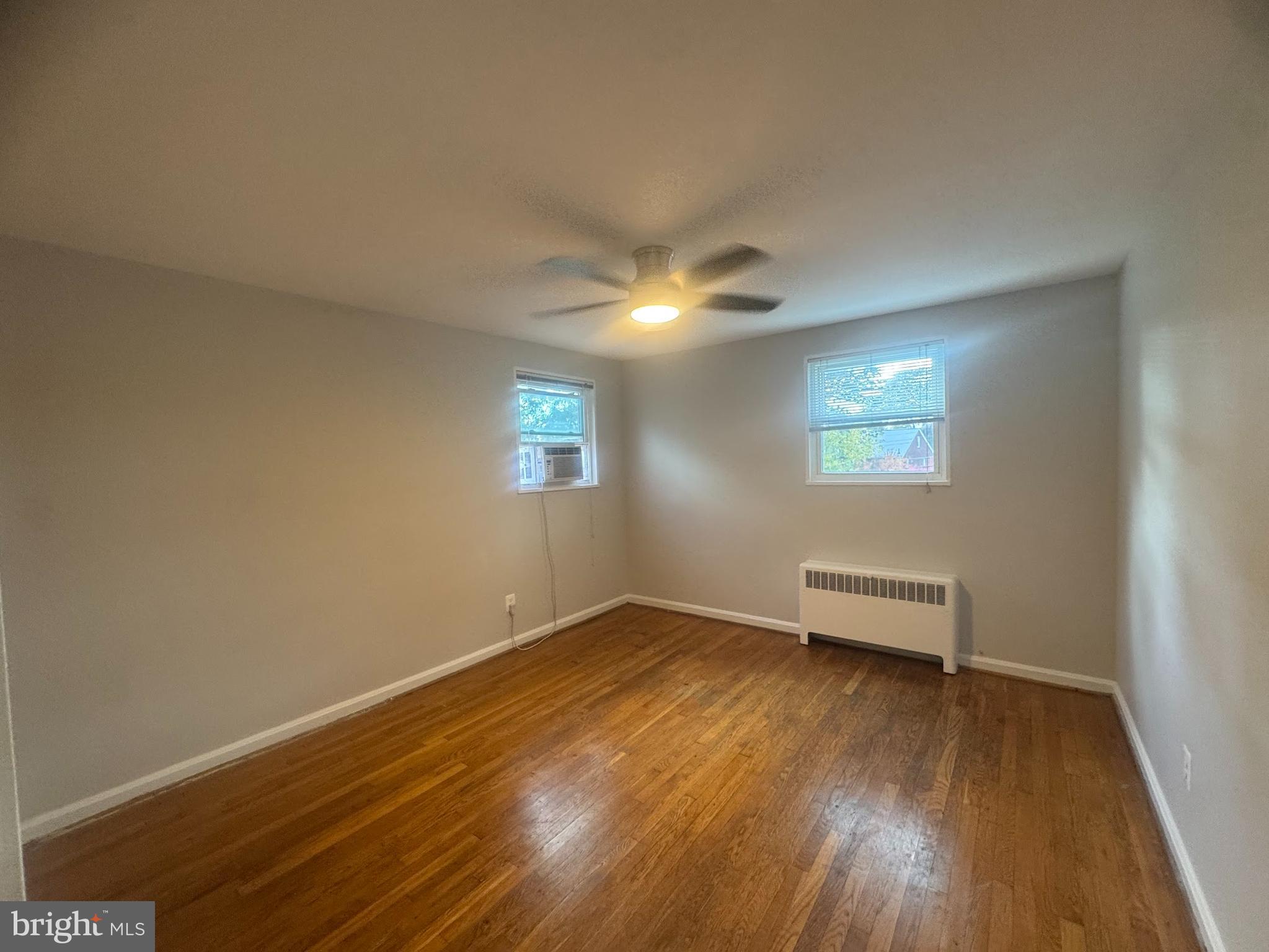 500 South Courthouse Road, Unit 9 Arlington, VA 22204 - Photo 12 of 18 a view of a livingroom with wooden floor and a window