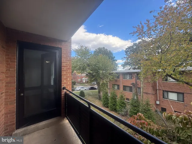 a view of balcony with wooden floor
