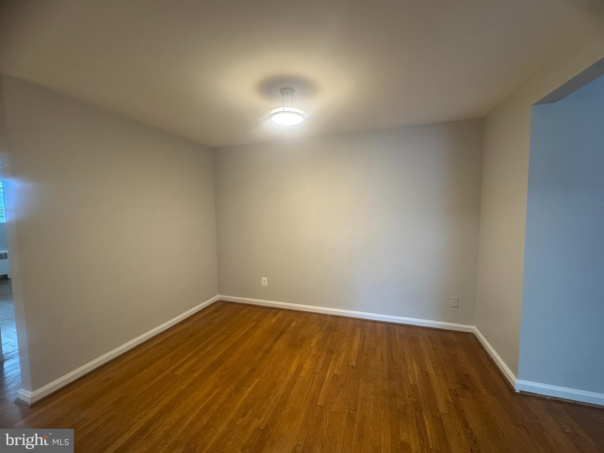 500 South Courthouse Road, Unit 9 Arlington, VA 22204 - Photo 9 of 18 a view of room with wooden floor