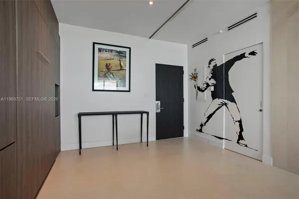 a view of an entryway with wooden floor