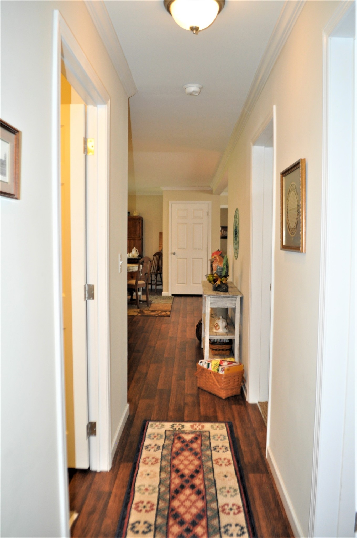 1134 Wrights Mill Road Spring Hill, TN 37174 - Photo 18 of 26 a hallway with wooden floor and furniture