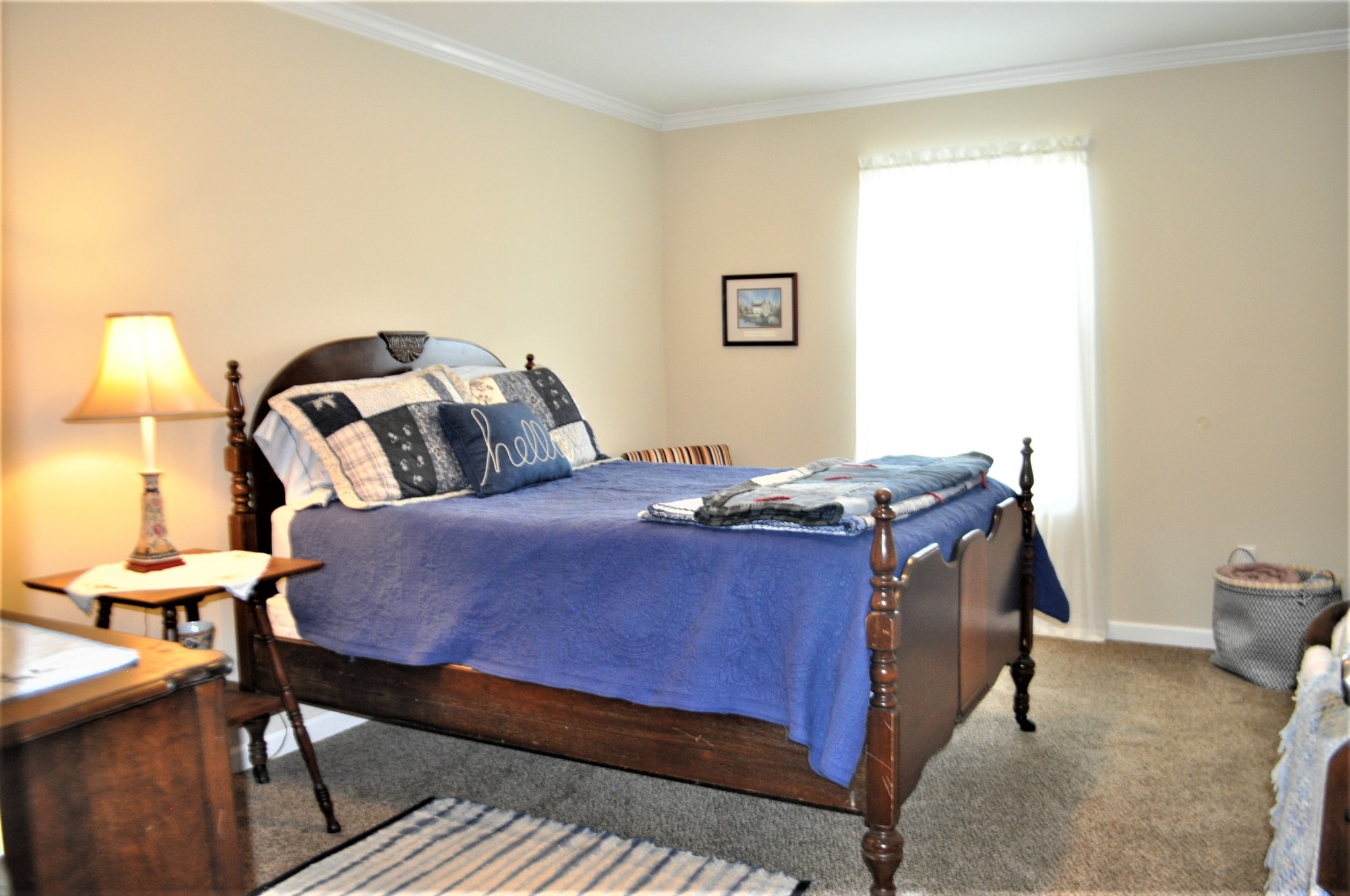 1134 Wrights Mill Road Spring Hill, TN 37174 - Photo 20 of 26 a bedroom with a bed and a lamp on table