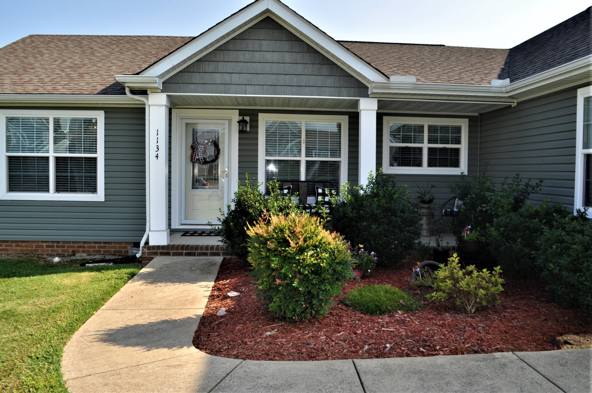 1134 Wrights Mill Road Spring Hill, TN 37174 - Photo 2 of 26 a front view of a house with garden