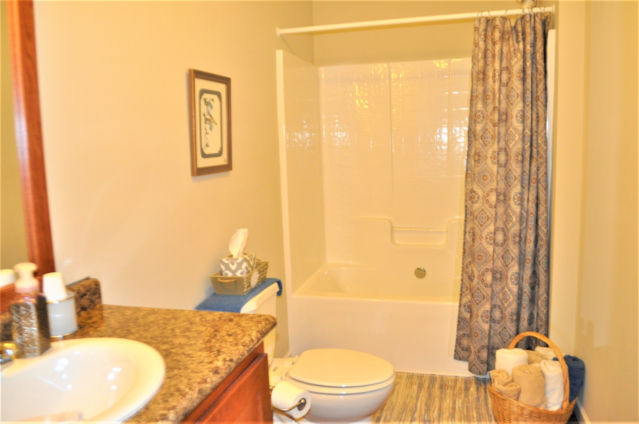 1134 Wrights Mill Road Spring Hill, TN 37174 - Photo 21 of 26 a bathroom with a granite countertop sink toilet and shower