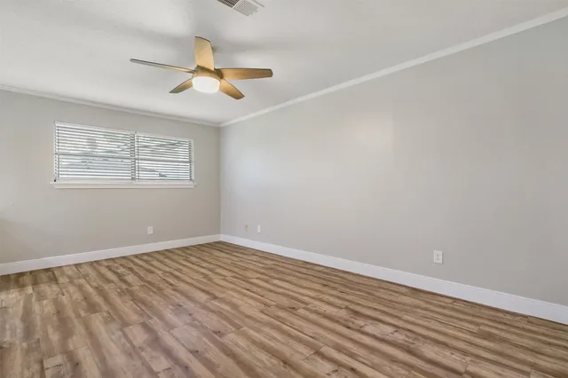 a view of a livingroom with wooden floor
