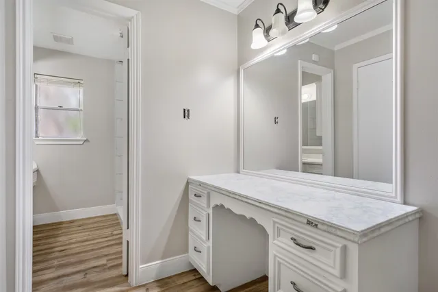 a bathroom with a sink double vanity and a mirror