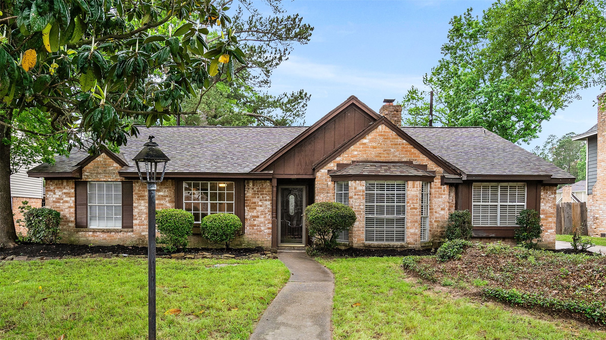 25519 Many Oak Drive Spring, TX 77380 - Photo 2 of 33 a front view of a house with a yard
