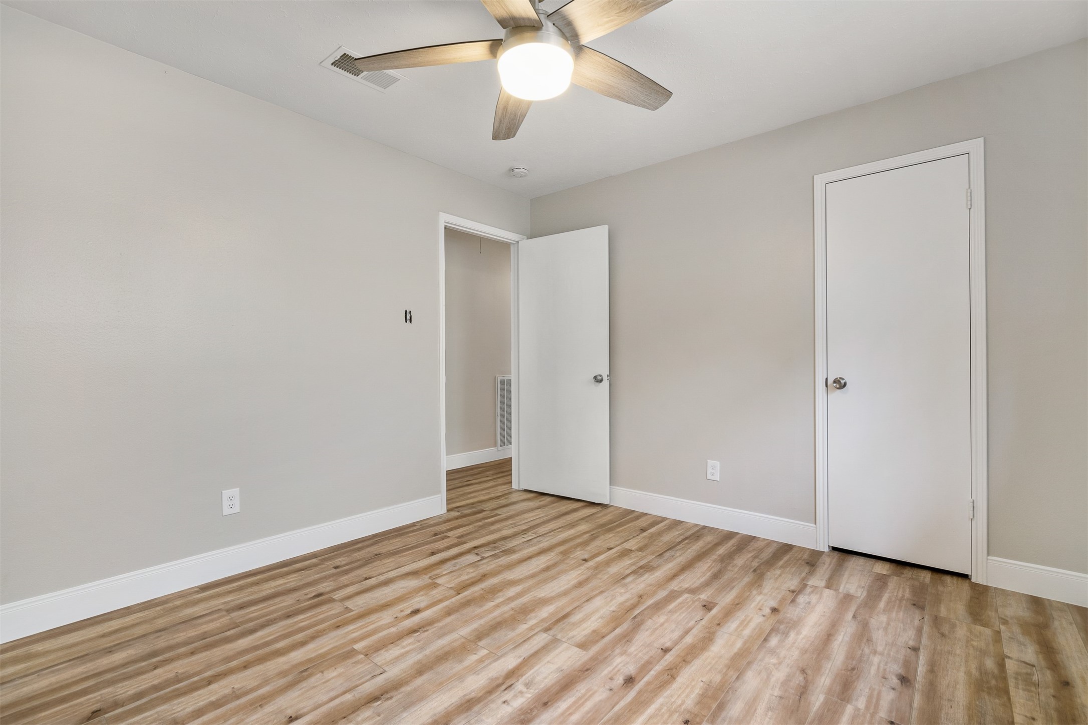 25519 Many Oak Drive Spring, TX 77380 - Photo 27 of 33 a view of an empty room with wooden floor