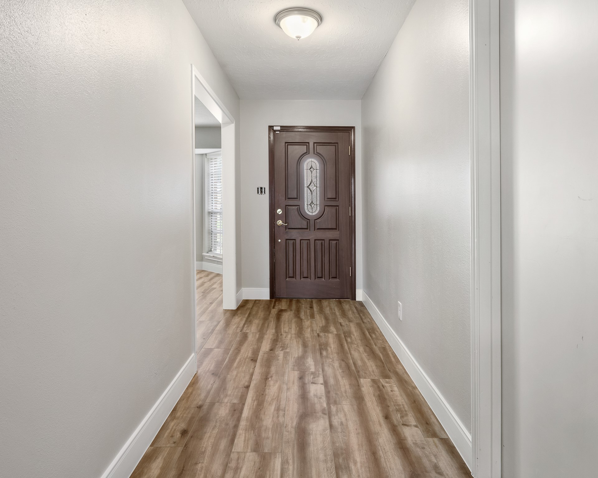 25519 Many Oak Drive Spring, TX 77380 - Photo 3 of 33 a view of a room with wooden floor