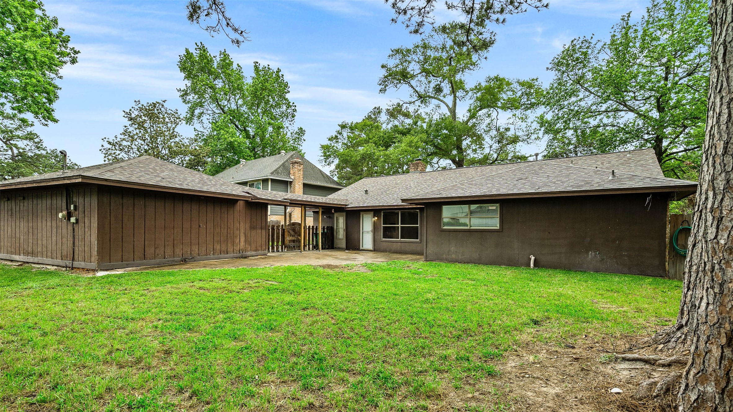 25519 Many Oak Drive Spring, TX 77380 - Photo 32 of 33 a view of a house with a yard and a large tree