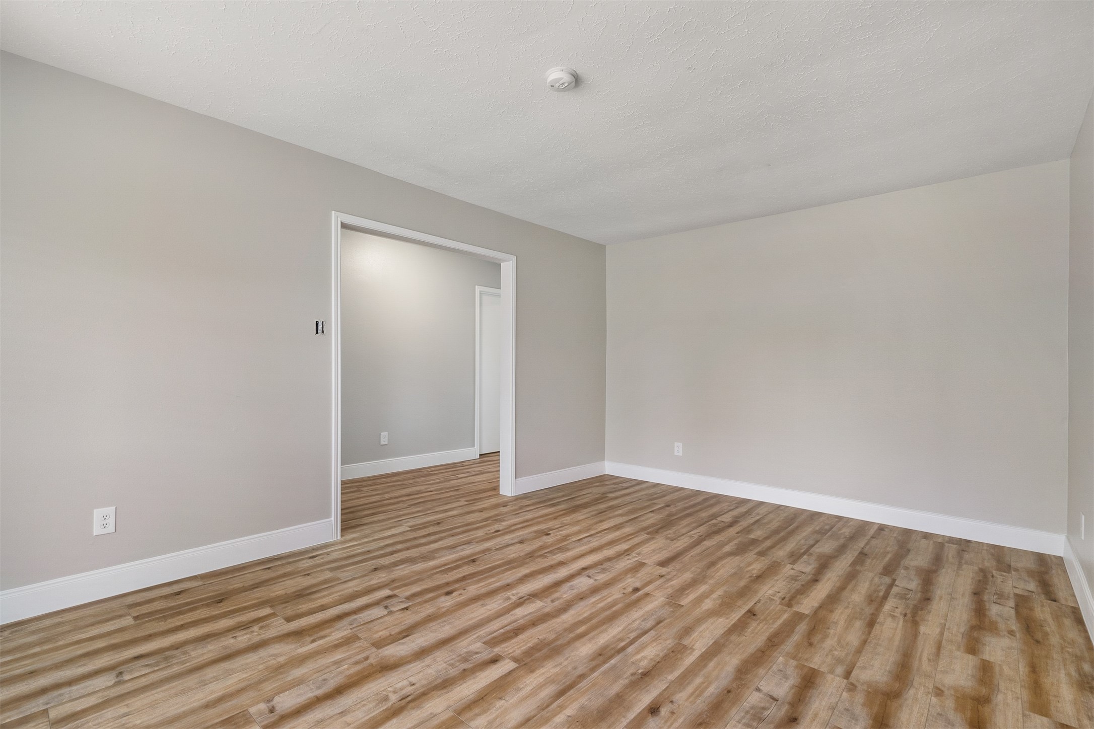 25519 Many Oak Drive Spring, TX 77380 - Photo 5 of 33 a view of an empty room with wooden floor
