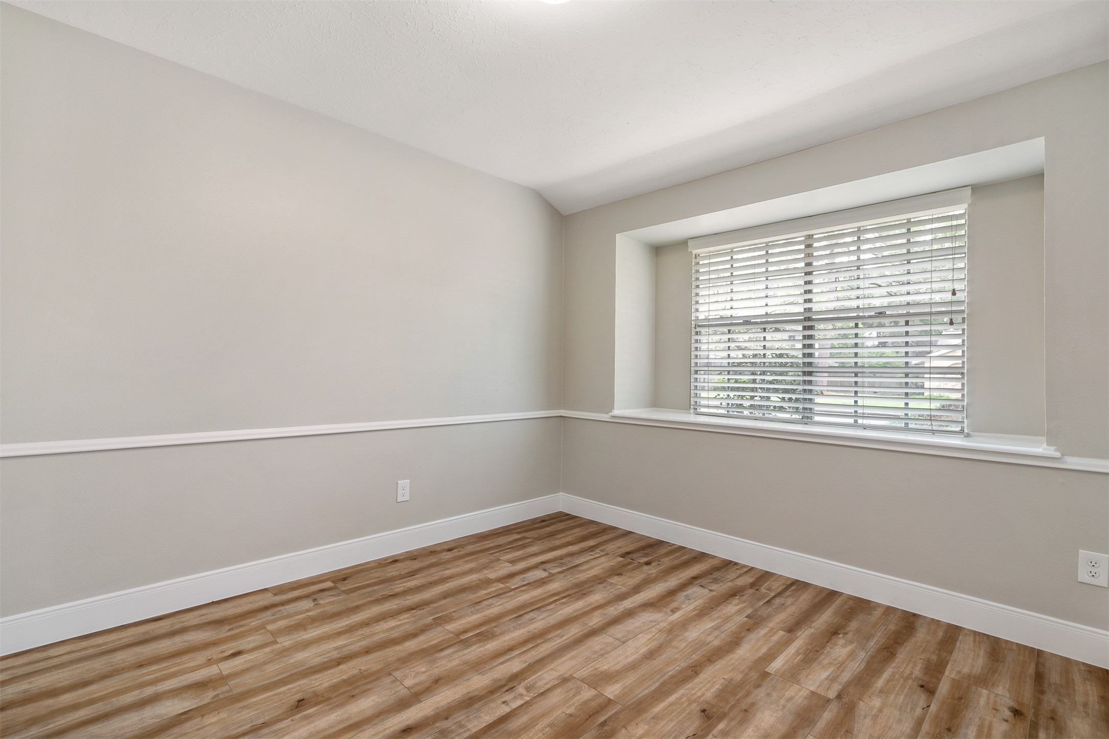 25519 Many Oak Drive Spring, TX 77380 - Photo 6 of 33 a view of a room with wooden floor and windows in it