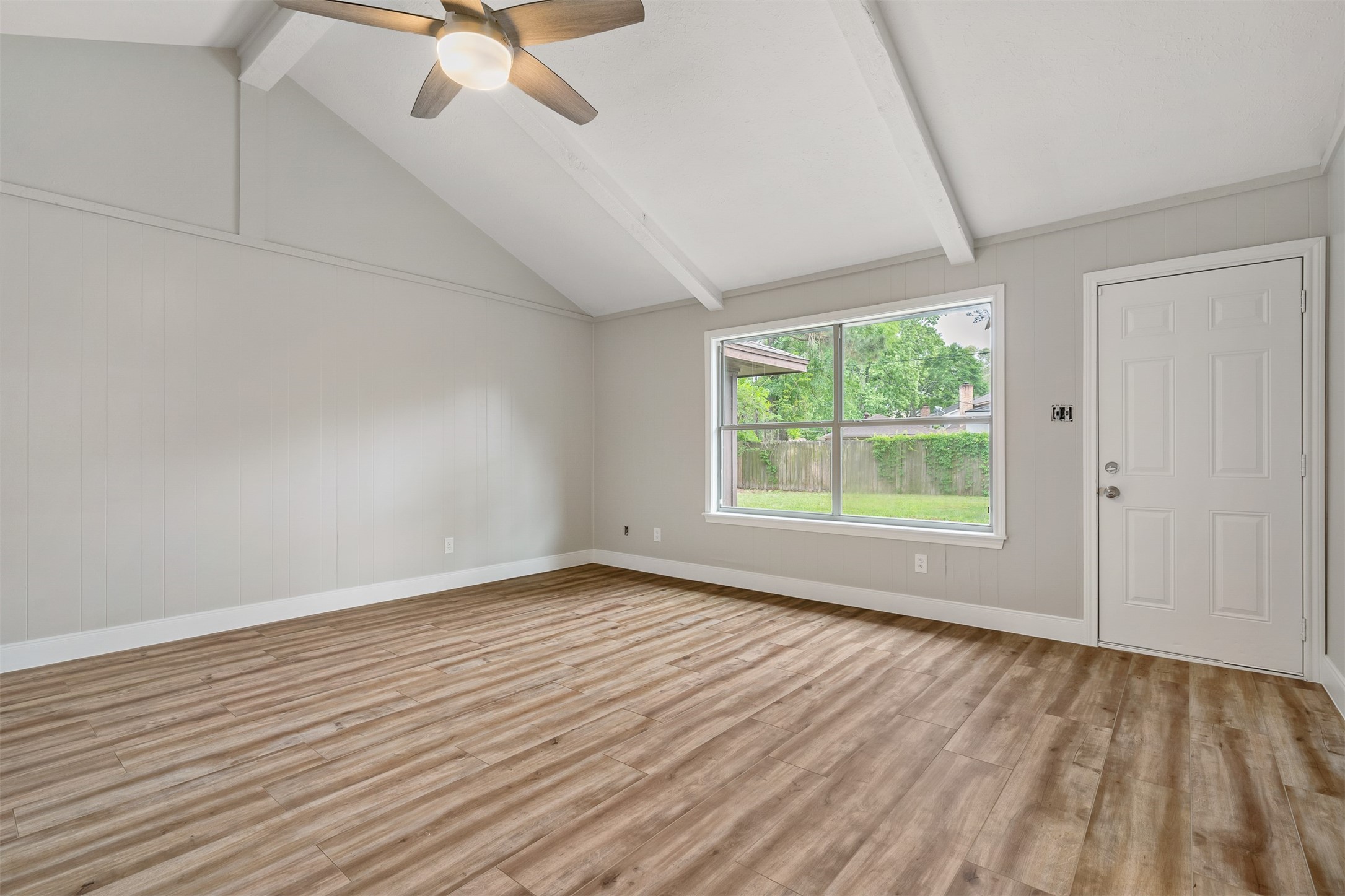 25519 Many Oak Drive Spring, TX 77380 - Photo 10 of 33 wooden floor in an empty room with a window