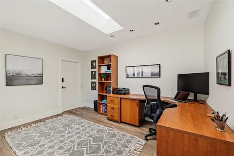 a workspace with furniture and window