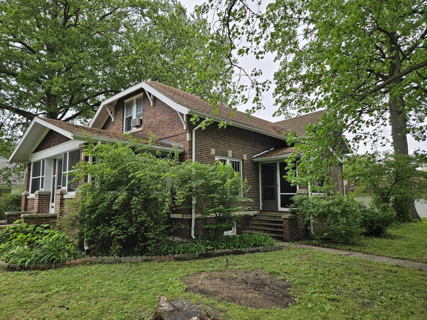 402 East 5th Street Flora, IL 62839 - Photo 5 of 29 a house with trees in the background